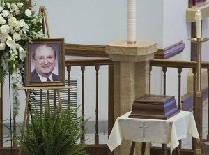A portrait of Paul Sparks sits next to his remains during his memorial service June 6 at St. Theodore Catholic Church in Albert Lea. – Colleen Harrison/Albert Lea Tribune