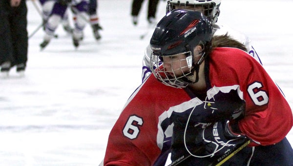 Maddi Hererra of Albert Lea battles for the puck Wednesday in the Section 1A quarterfinals at Red Wing. —Kyle Stevens/Republican Eagle
