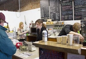 Patrick Hanson, right, his wife, Joy, center, and his sister, Chloe, work at Prairie Wind Coffee on Friday. The coffee shop is expanding some of its offerings and is changing its name later this month. - Sarah Stultz/Albert Lea Tribune