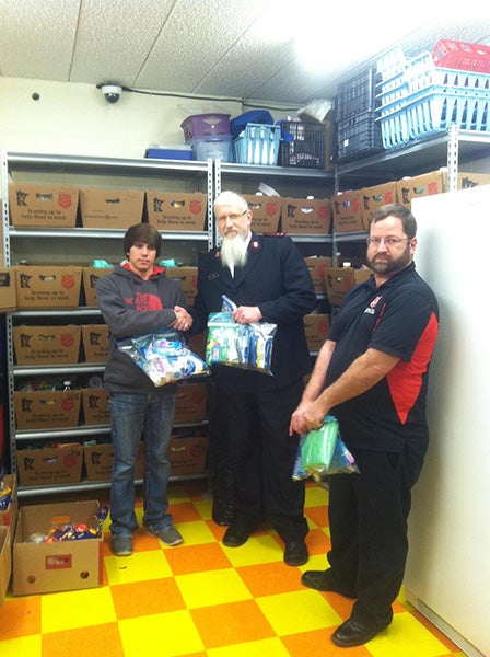 Bailey Williams, from Troop No. 219 “Mountain Men,” presented 50 comfort kits as part of his Eagle Scout badge project to Capt. Jim Brickson and case worker Jason Mead of the Salvation Army in Albert Lea. The comfort kits included items such as toothbrushes, toothpaste, soap, razors and other personal hygiene items for both men and women. - Provided 
