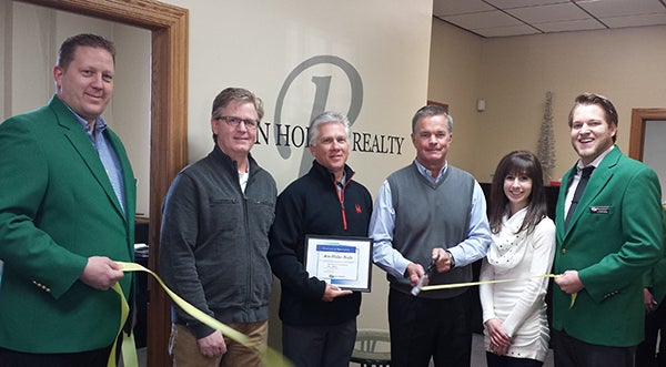 Albert Lea-Freeborn County Chamber of Commerce Ambassadors welcome new owners Rick Mummert and Craig Hoium from Ron Holtan Realty to the chamber. - Provided