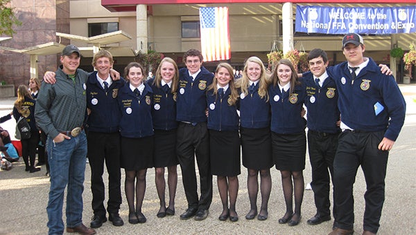 FFA students in official dress pose for a picture at the national FFA convention in Louisville, Kentucky, in October 2013. From left to right are Mic Skaar, Jay Skaar, Brianna Opdahl, Taylor Willis, Dustin Viktora, Kayla Overland, Calin Adams, Brooke Rye, Justin Viktora and Dustin Mattson. - Provided