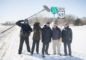 Rasmussen poses with the crew of "Travels Waes." The Belgian TV show travels to different parts of the world and is currently filming a segment on U.S. Highway 65 for its second season on the air. — Colleen Harrison/Albert Lea Tribune