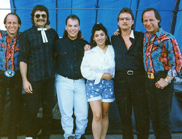 Denny Charnecki, second from right, stands with  Pete Jacobson, second from left, and members of the “Hee Haw” tour. Charnecki and Jacobson are both from Austin. - Provided
