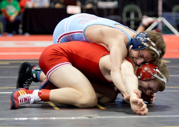 Albert Lea's Garrett Aldrich wrestles Aaron Hingst of Simley Friday at 120 pounds during the first round of the Class AA state wrestling tournament. Adrich won the match at Xcel Energy Center in St. Paul. -  Colleen Harrison/Albert Lea Tribune