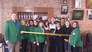 Albert Lea-Freeborn County Chamber of Commerce ambassadors were out in force Wednesday morning to extend a big, green welcome to Lisa Hanson and Patrick Hanson in celebration of the name change of their business to The Interchange Wine & Coffee Bistro. - Provided