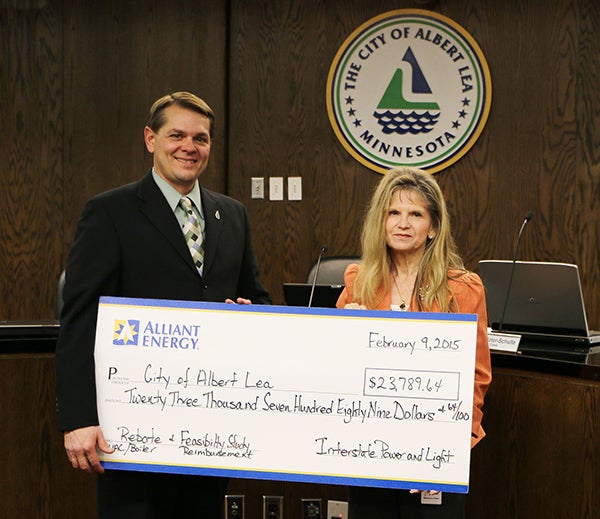 At the Feb. 9 council meeting, Rebecca Gisel of Alliant Energy presented a rebate check to the city of Albert Lea and Mayor Vern Rasmussen in the amount of $23,789.62 for replacement of the boiler at City Hall and the second half payment of IPL’s feasibility study. -Provided