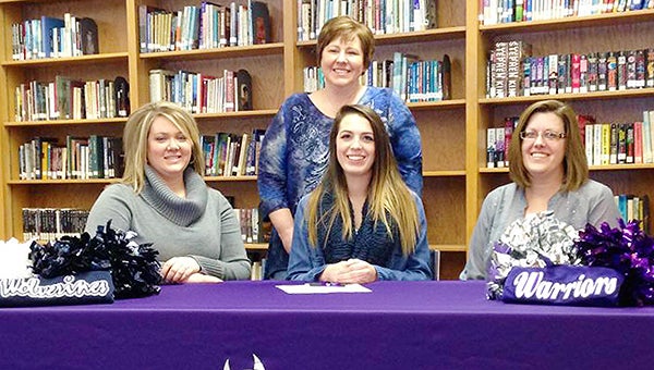 Glenville-Emmons senior Kristen Hahn signed her national letter of intent Wednesday to attend Waldorf College and participate in cheerleading. Front row from left are Glenville-Emmons cheerleading coach, Tabitha Page, Hahn and Waldorf coach Dyanna Quisling. Hahn’s mother, Brenda Hahn, stands behind her. — Provided