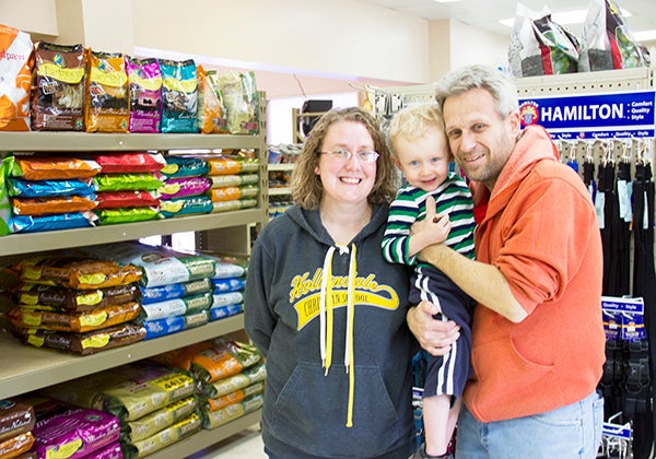 Tom and Tanya Theesfeld stand with their son, Payton, inside their new store, Elite Pet & Garden, on Friday. Tom Theesfeld said his son, 3, likes to tell people Elite Pet & Garden is his store. -Sarah Stultz/Albert Lea Tribune 