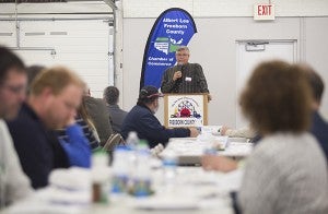 Chuck Schwartau recognizes past recipients of the Farm Family of the Year Award Tuesday during the 10th annual Agriculture Luncheon at the Freeborn County Fairgrounds. - Colleen Harrison/Albert Lea Tribune