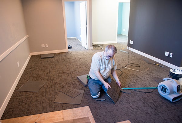 Carpeting is put in at the future site of an employee clinic Feb. 6. The clinic will be in the same building as Dr. John Enger’s podiatry practice at 904 E. Plaza St. in Albert Lea. -Colleen Harrison/Albert Lea Tribune