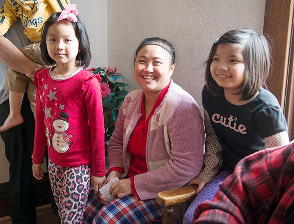 Kler Say sits in between her daughters Leah Say, left, and New New. Kler Say, a member of the local Karen community, will officially be a U.S. citizen after her naturalization ceremony Thursday. — Colleen Harrison/Albert Lea Tribune