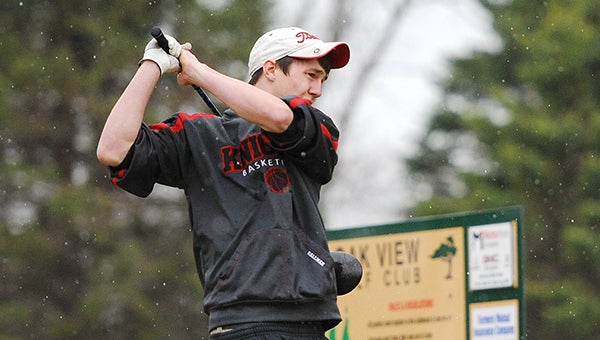 Eli Hallman of Alden-Conger drives the ball Monday in the rain on the first hole at Oak View Golf Club. — Micah Bader/Albert Lea Tribune
