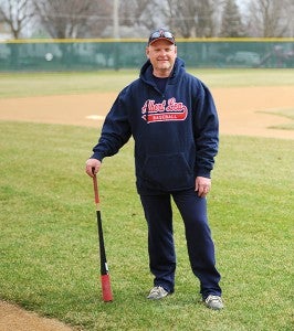 Jay Enderson stands with a bat Monday at Hayek Field in Albert Lea. Enderson is starting his seventh season as a varsity assistant on head coach Joe Sczublewski’s staff. In the summer, Enderson is head coach of the Albert Lea Legion Post 56 baseball team. - Micah Bader/Albert Lea Tribune