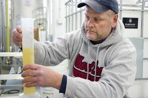 When fermenting wine, the yeast eats the sugar in the juice then turns it into alcohol. Towards the end of the fermentation process, Three Oak Wines owner Jay Enderson checks the wine every day to look at the sugar content. -Hannah Dillon/Albert Lea Tribune