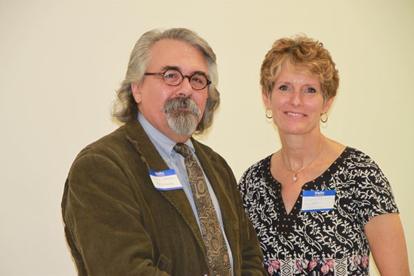 Lyle Jensen, left, of Tentmakers Inc. stands with Jillian Peterson, board chairwoman of the Freeborn County Communities Foundation. - Provided