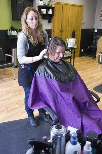 Jenny Sather works on the hair of Penny Jahnke Friday at JC Salon in the Knutson building. - Sarah Stultz/Albert Lea Tribune