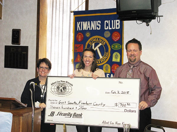 President Lance Skov, representing Noon Kiwanis, and honors the local Girl Scout Freeborn service unit with a donation. The money supports events in Freeborn County that promote girls and community. Accepting the check is Service Unit Manager MaChar Kingstrom and Ambassador Girl Scout Hanna Kingstrom. - Provided