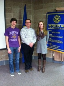 Tyler Andersen and Riley Schulz share what is going on at the high school with Rotary. Pictured with them is Rotary President Garry Hart. Provided