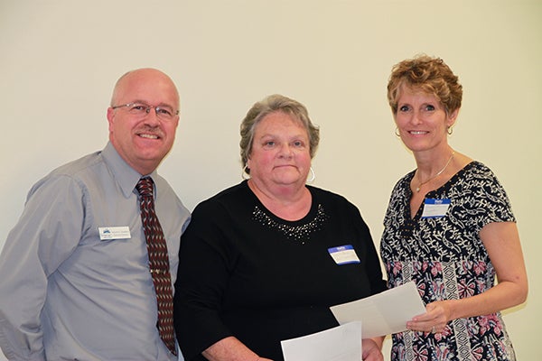 Wayne Stenberg, Semcac executive director, and Vicky Helland from Semcac and Jillian Peterson, board chairwoman of the Freeborn County Community Foundation. - Provided 