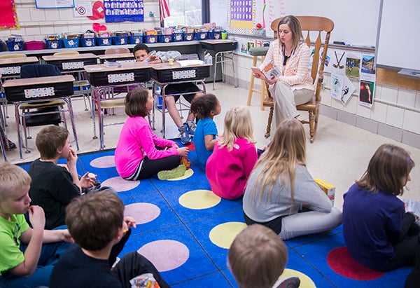 Erika Youlden reads to her fourth-grade class Tuesday at Sibley Elementary School. Youlden’s class learned about Native Americans in March through a grant for the Perpich Center for Arts Education. - Colleen Harrison/Albert Lea Tribune