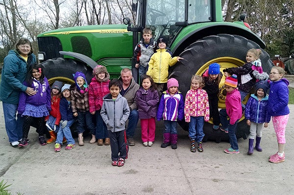 The preschool, kindergarten and first grade students of St. Casimir’s Catholic School in Wells visited the Dennis and Diane Lutteke organic dairy farm to learn how milk is produced. During their visit, the students learned how to milk a cow and saw the big tank where the milk is stored until it is transported to Organic Valley (a farmer-owned co-op) for bottling. The students also enjoyed the thrill of feeding the baby calves and received a ride on a tractor. Following these activities, the students were treated to a delicious snack of cheese and chocolate milk by the Luttekes. -Provided