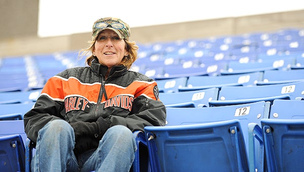 United South Central athletic director Sue Summer sits Saturday on a seat that was installed in the Rebels’ new stadium. The Rebels hosted their first track meet at the new facility on April 17. — Micah Bader/Albert Lea Tribune