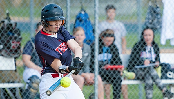 Kassi Hardies of Albert Lea crushes a home run over the center field fence Tuesday against Faribault at Hammer Field. — Micah Bader/Albert Lea Tribune