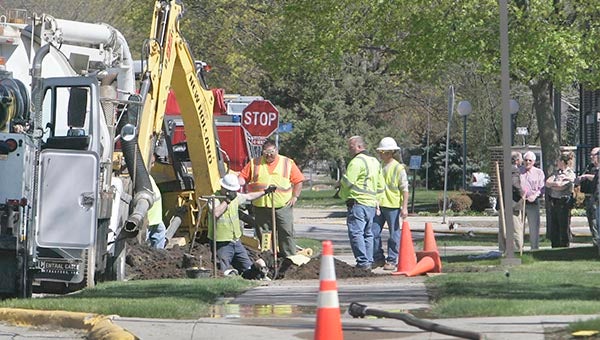 Crews from Alliant Energy work to repair a punctured natural gas line on the west side of the Worth County Courthouse in Northwood Wednesday morning. — Jeff Heinz/Mason City Globe Gazette