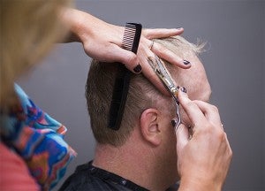 Morgan Meaney cuts Chase Bakker's hair Friday at Studio 22 Salon. — Colleen Harrison/Albert Lea Tribune