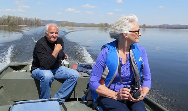 Winona area wood sculptor Leo Smith and his wife, Marilyn, make frequent outings from their river's edge home two miles downriver from Winona on the main channel of the Mississippi. Smith said the river is a source of inspiration for many of his sculptures. — Dan Olson/MPR News