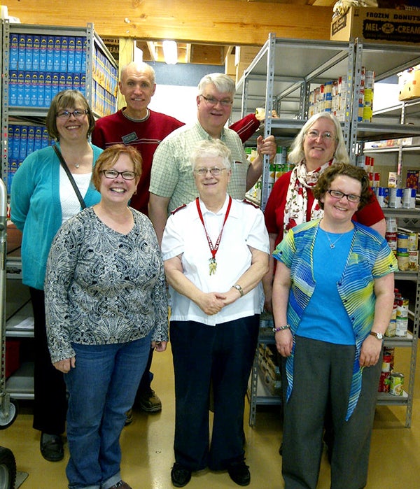 Members of the Freeborn County Ministerial Association met for their monthly meeting at the Albert Lea Salvation Army Citadel to help stock food shelves. Supplies are low, so the association is encouraging people to support the National Association of Letter Carriers Food Drive on Saturday. - Provided