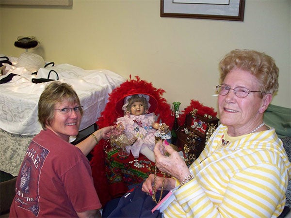 Wanda Wangsness and her mother, Ida Mildenstein, work on a display of jewelry for the 2010 Mother's Day tea. — Provided