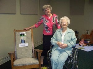 St. John's Lutheran Community resident Pearl Lindeman with one of her daughters at the 2013 Mother's Day tea. Lindeman is with her rocking chair, as the theme for that year was rocking chairs. — Provided