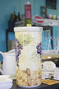 As well as doing painting in-store, Brook Byars, owner of Highway 69 Pottery in Lake Mills, does parties where she brings the supplies. This wine holder was a project from one of those parties. - Hannah Dillon/Albert Lea Tribune