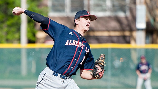 Tyler Steele of Albert Lea throws to first base in an attempt to pick off a Red Wing runner Wednesday at Hayek Field. — Micah Bader/Albert Lea Tribune