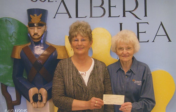 Joyce Fredin of the Freeborn County Chapter of Thrivent Financial presents a $300 check to Pat Mulso, director of the Freeborn County Historical Museum, for their soup and dessert fundraiser last month. - Provided