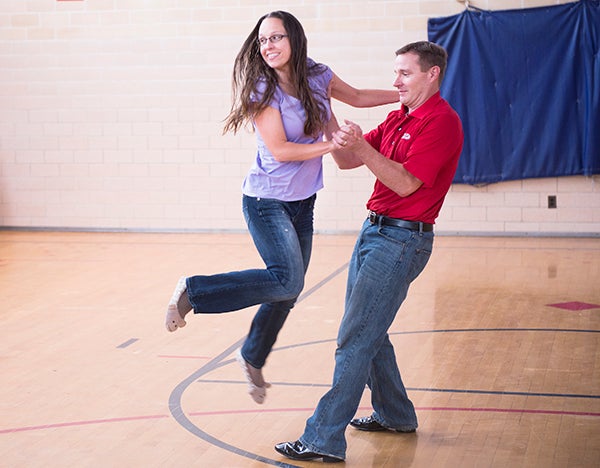 Diane and Mark Petrik rehearse the foxtrot Wednesday at Banfield Elementary School in Austin. The couple will dance in Saturday’s Dancing with the Freeborn-Mower Stars event at Albert Lea High School. - Colleen Harrison/Albert Lea Tribune
