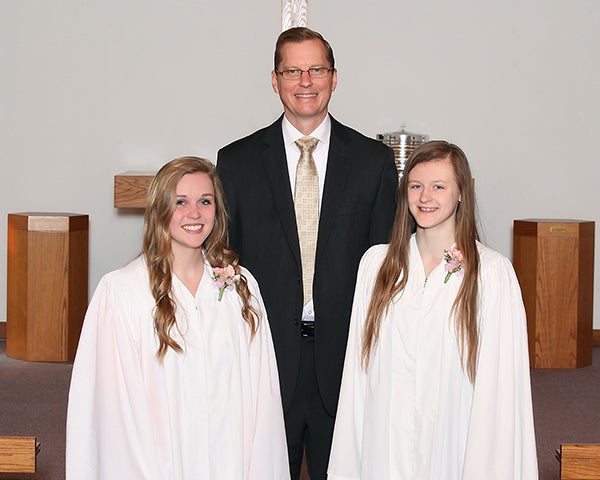 On May 3, two youth at Faith Lutheran Church of London were confirmed. From left is Kendal Truckenmiller, the Rev. Kent Otterman and Faith Gasteiger. - Provided