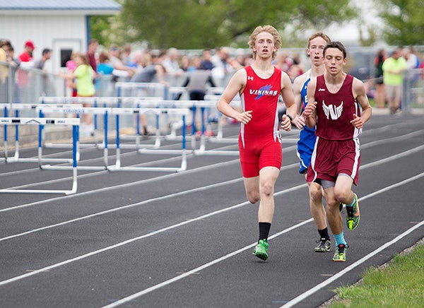 Northwood-Kensett’s Keano Batton, left, competes in the 3,200-meter run Friday during the District 1A state qualifying meet at Northwood. Batton took third place with a time of 11:08.98. The Vikings won the 12-team boys’ meet and the 10-team girls’ meet and qualified for the boys’ state meet in six events and the girls’ state meet in six events. — Colleen Harrison/Albert Lea Tribune