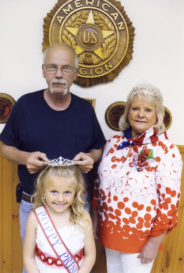Judy Nelson, right, was declared 2015 Senior Poppy Queen for Glenville by Louise Attic, president of the Glenville American Legion Auxiliary. Glenville’s mayor, Wes Webb, placed the crown on the head of Brielle Bakken, declaring her 2015 Poppy Princess on May 18 at the Glenville American Legion. Bakken is the daughter of Andy and Jody Bakken of Albert Lea and the granddaughter of Judy Nelson. - Provided