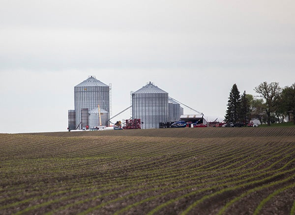 Rescue services from multiple areas respond to reports of a man trapped in a grain bin Wednesday northeast of Geneva. - Colleen Harrison/Albert Lea Tribune