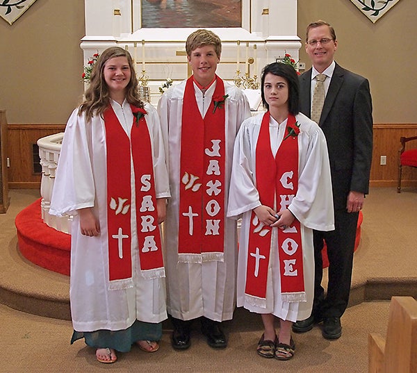 Three youth were confirmed at Round Prairie Lutheran Church of rural Glenville on May 3. From left are Sara Allison, Jaxon Heilman, Chloe Larson and the Rev. Kent Otterman. -Provided