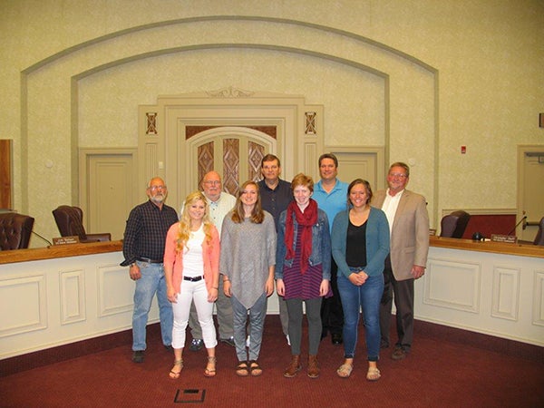 The Freeborn County Board of Commissioners recently awarded five Freeborn County high school seniors with $500 scholarships. The scholarships were provided by Diamond Jo Casino and students were presented with an award during the regular board meeting on May 19.  County Administrator John Kluever said this was the 8th year of these awards and thanked Diamond Jo Casino with their partnership over the  years. Back row, from left, are Commissioners Jim Nelson, Mike Lee, Dan Belshan, Christopher Shoff and Glen Mathiason. Front row, from left, are students Jessica Price of Alden-Conger, Anna Englin of Albert Lea, Solveig Lange of Albert Lea and Cassandra Gilster of Alden-Conger. Madalyn Wangen of Glenville-Emmons was unable to attend the presentation. -Provided