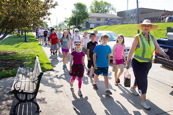 St. Theodore Catholic School students take part in a walking school bus to Edgewater Park Wednesday morning. -Sarah Stultz/Albert Lea Tribune