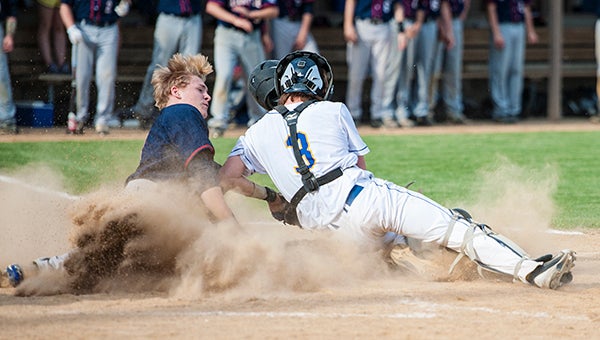 Albert Lea's Ben Witham slides past Waseca catcher Jacob Walter to score a run in the bottom of the fourth inning Thursday in the Subsection 2AA South finals. — Micah Bader/Albert Lea Tribune