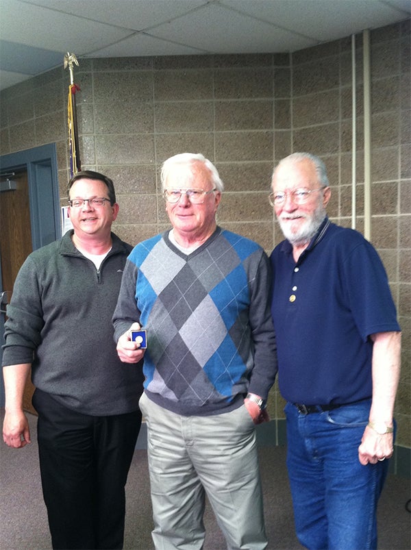 Casey Swenson, middle, and Bill Danielsen, right, are recipients of the Paul Harris Fellowship Award.  Giving the award is Albert Lea Rotary President Garry Hart, left. — Provided