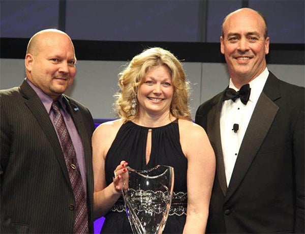 Scott and Sarah Larson are presented The President’s Cup by Beltone President Todd Murray. — Provided