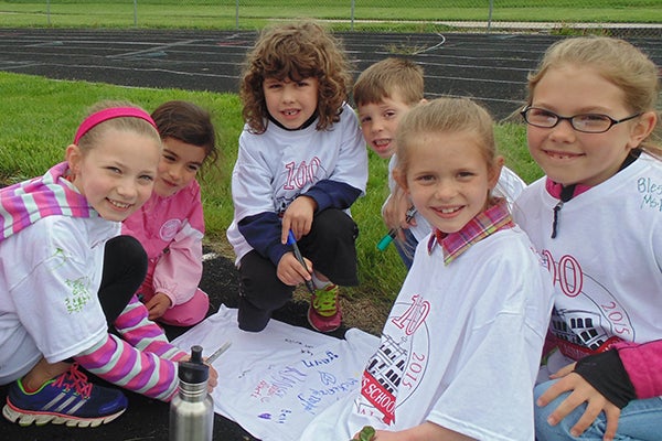 St. Casimir’s School students McKenzie Roberts, Julianna Clore, Evelyn Hassing, Stacy Adams, Brooklyn Miller and Emma Johnson participated in the time-honored tradition of signing each others shirts during the school’s track and field day. With the help of school parents, alumni members and effort on the part of St. Casimir’s School teachers, the St. Casimir’s School 2015 Track and Field Day proved to be another successful event. St. Casimir’s staff thanks the generous donors of the SCS centennial shirts, which the students took delight in wearing during the event. - Provided