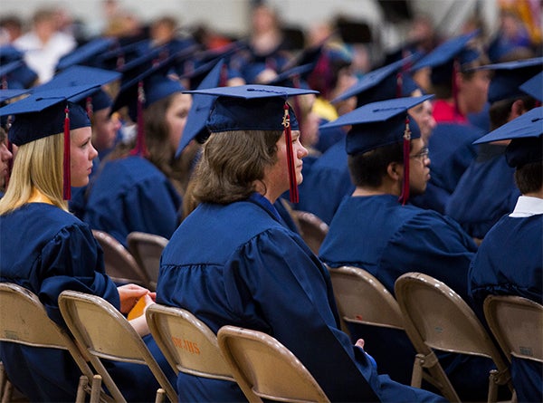 Albert Lea High School seniors listen to their fellow students sing in the choir during Friday's commencement at the high school. — Colleen Harrison/Albert Lea Tribune